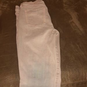 Size 26 light brown skinny jeans.